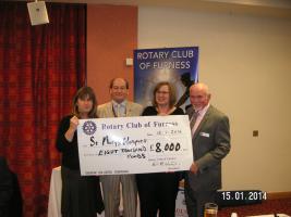 Rotarian Ian Richardson gives President Dave a banner from his club.